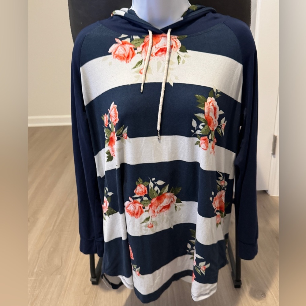Women’s size med hooded blue and floral striped shirt. Brand Emerald.